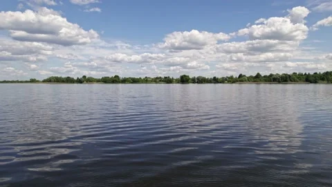 Lake landscape, cloudy clean sky reflectded in water Stock Footage 155349941