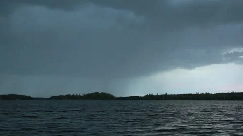 Lake landscape with rain clouds moving behind the lake Stock Footage 54505625
