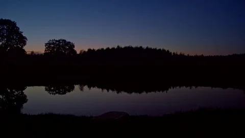 Lake, magic hour, handheld, medium shot 02/02 Stock Footage 82424146