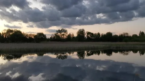 Lake, mere, sky after sunset, dark sky, clouds, scream of birds Stock Footage 130876718