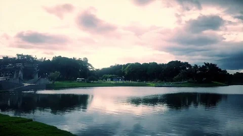 Lake in the middle of a sunset in the park Stock Footage 72682377