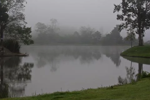 Lake in the mist Stock Photos