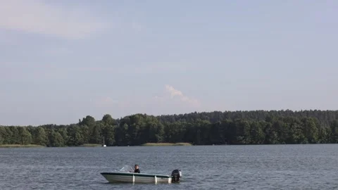 Lake with a motor boat - timelapse Stock Footage 244876567