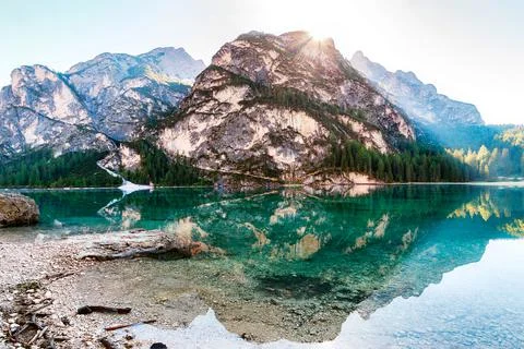 A lake with a mountain in the background Stock Photos