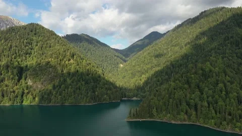 Lake in the mountain, forest on mountain slopes, view from above Stock Footage 151649666
