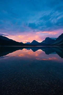 Lake with a mountain range in the background Stock Photos