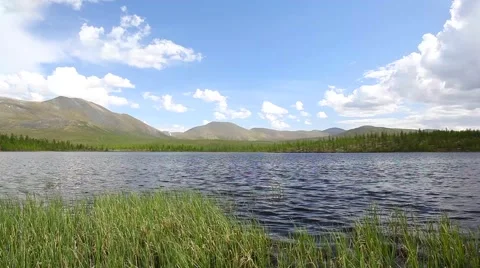 Lake with mountains in the background Stock Footage 64894898