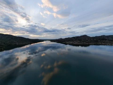 Lake in the mountains in the evening Stock Photos
