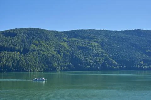 Lake mountains forest excursion boat summer Lake Millstatt Doebriach Carinthia Stock Photos