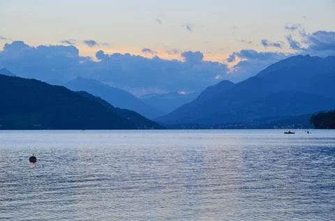 Lake mountains sky clouds sunset twilight summer Lake Millstatt Doebriach Stock Photos