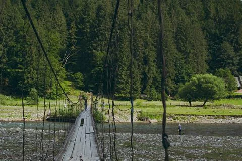 A lake in the mountains with trees Stock Photos
