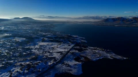 Lake in the mountains in winter, clouds, mountains, winter, nature Video stock 304703415