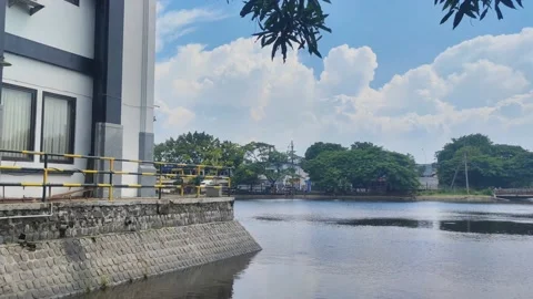 The lake next to the mosque building during the day looks peaceful 4K 30FPS Stock Footage 168890812
