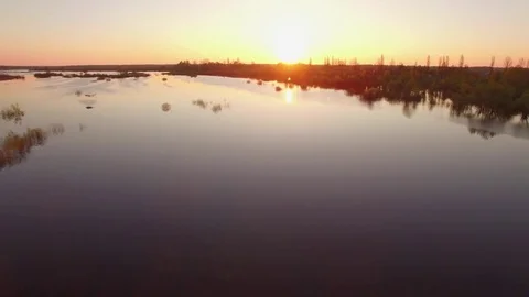 Lake or flooded river at sunset or sunrise aerial 4k Stock Footage 75040170