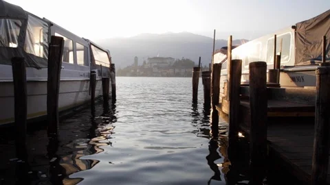 Lake Orta low angle between two moored boats, slow motion Stock Footage 122280516