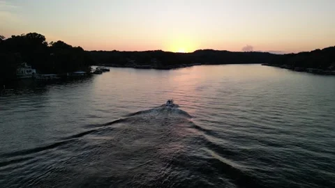 Lake of the Ozarks Sunset Chase – Drone Over Water with Boat and Tree Line Stock Footage 320809118