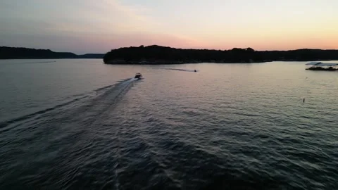 Lake of the Ozarks Sunset Chase – Drone Over Water Following Boat Stock Footage 320809121
