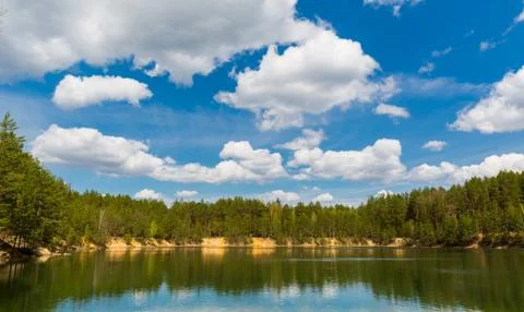 Lake in pine forest Stock Photos