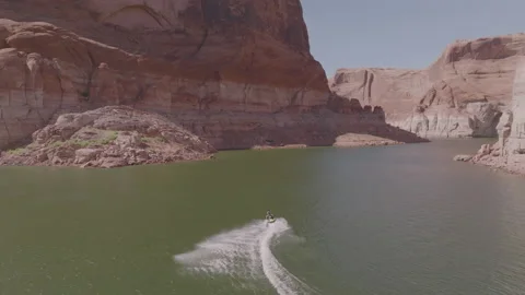 Lake Powell man rides wave runner fast Arizona Utah vacation 動画素材 221453548