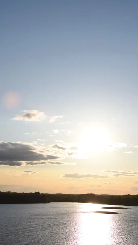 Lake in the rays of the evening sun. Landscape lake and forest Stock Footage 242334655