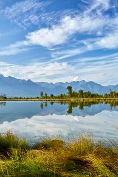 Lake with reflection of mountains in summer Stock Photos