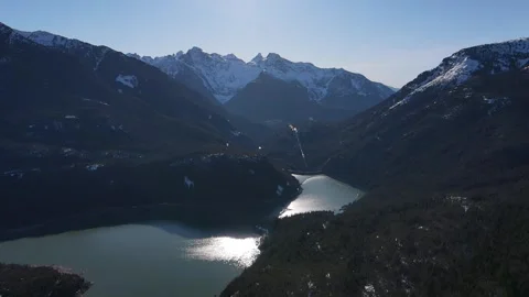 Lake reflection in the north cascades over a dam 스톡 동영상 332730206