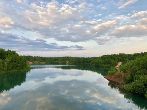 Lake with reflection of the sky Stock Photos