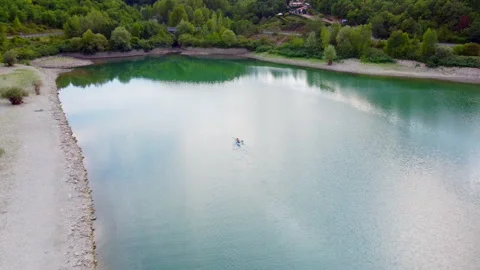 Lake reflections in tuscany with dynamic clouds Stock Footage 320848929