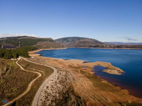 Lake with road in drone view Stock Photos