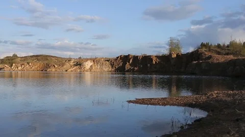 Lake with rocks on the beach Video stock 82749970