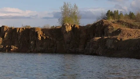 Lake with rocks on the beach Video stock 82749972