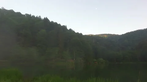 Lake scene deep in the forest and mountains, 4K Stock Footage 67262275