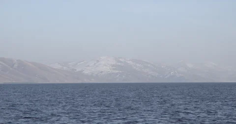 Lake Sevan Armenia wide calm water shot 4K Stock Footage 326632446