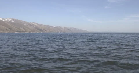 Lake Sevan Armenia Wide Shot with Mountains 4K Stock Footage 326635801