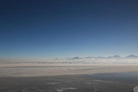 Lake Sevan covered with ice Stock Photos