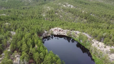 Lake Shaitankol meaning Devil's Lake Karkaraly. Drone view Stock Footage 199464703