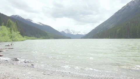 Lake shore with mountain backdrop Stock Footage 110389090