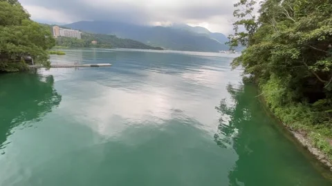 Lake Shore Water Surface and it's Reflection Stock Footage 246977082
