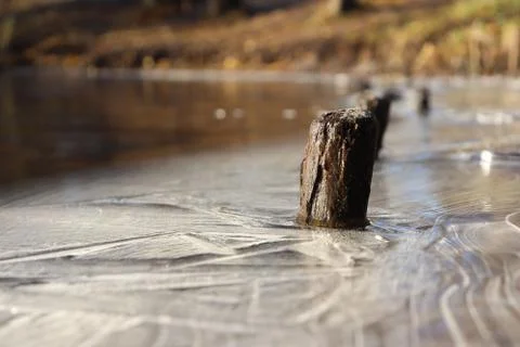 Lake Shoreline Ice Lines Pattern Surface Background Texture. Wavy Drawings of Stock Photos