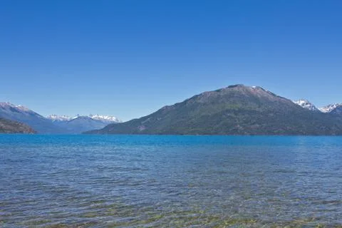 Lake side with mountain range in the background close to El Bolsn. Perfect .. Stock Photos