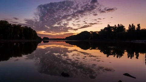 Lake in spring at dawn. Reflection of clouds in water Stock Footage 90830462