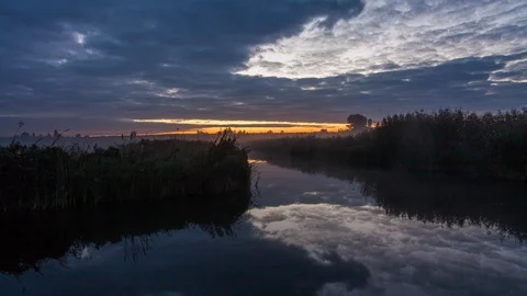 Lake in spring at dawn. Reflection of clouds in water Stock Footage 90830950