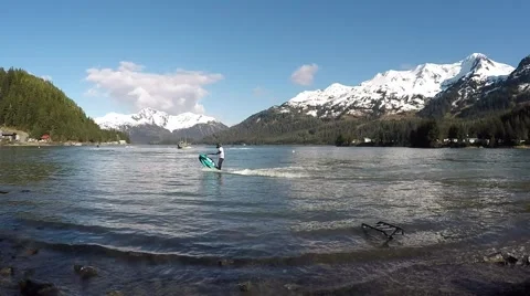 Lake Stand-up Jet Ski Back Flip Off Fishing Boat Wake with Natural Audio Stock Footage 51262509