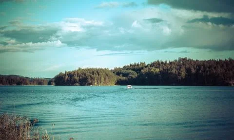 Lake summer view with reflection of clouds on water, Finland Stock Photos