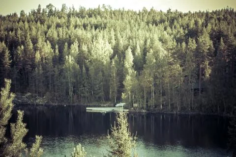 Lake summer view with reflection of clouds on water, Finland Stock-Fotos