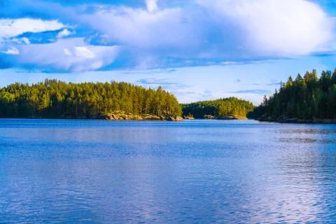 Lake summer view with reflection of clouds on water, Finland Stock-Fotos