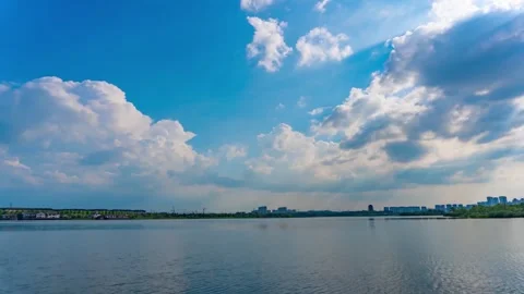 Lake Sunbeams Through Clouds Time Lapse with Moving Clouds Stock Footage 319775645