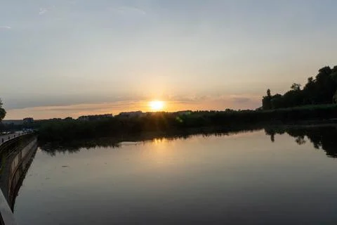 A lake with the sunset in the background Stock Photos