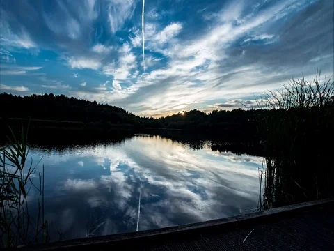 Lake sunset clouds time lapse Video stock 77443718