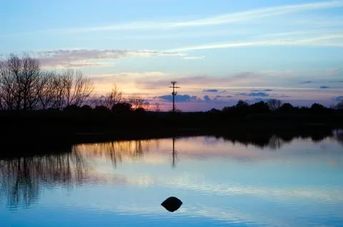 Lake at sunset Stock Photos